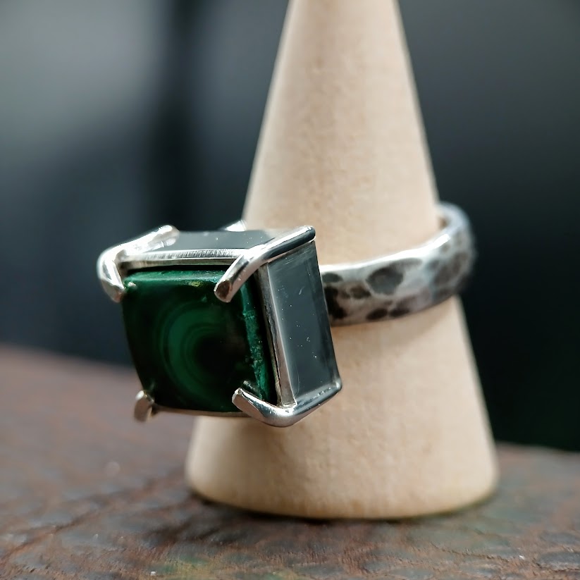 Silver and Malachite ring on wooden cone display