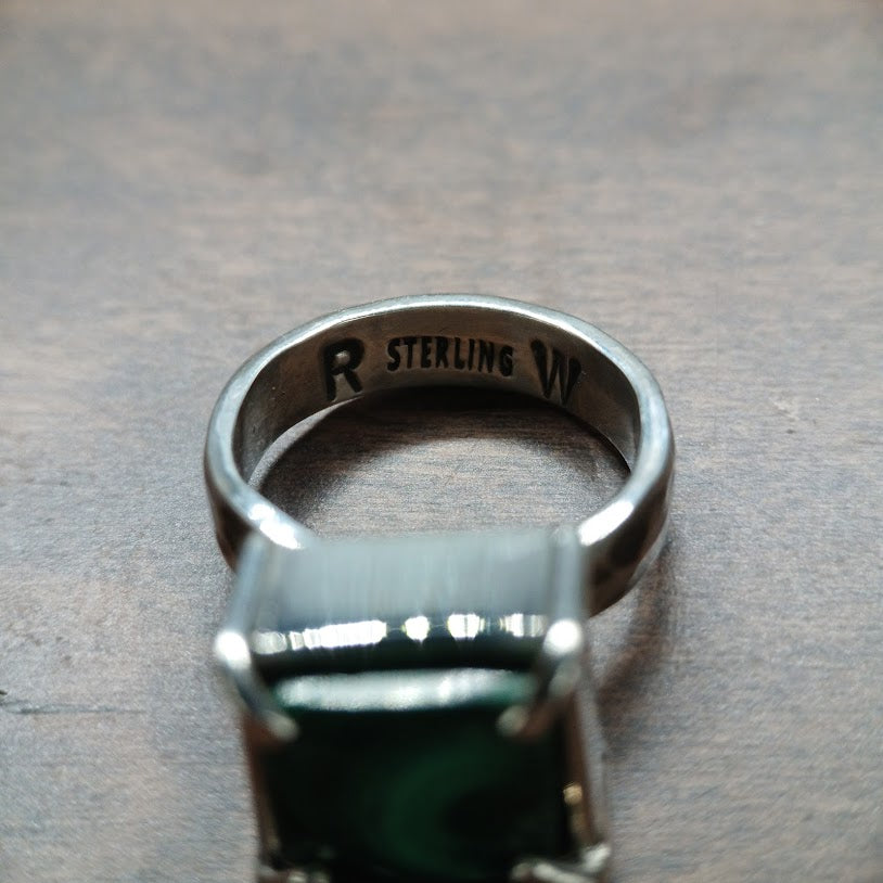 Silver and green stone ring showing hallmark stamp R STERLING W