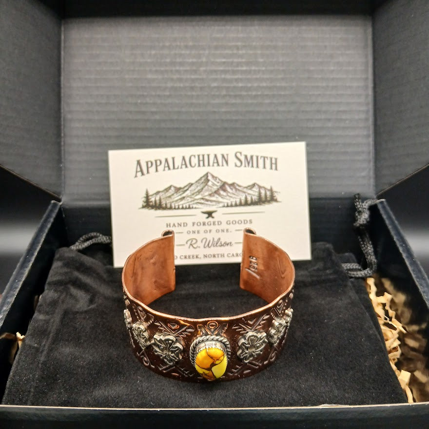 Decorative bracelet with yellow center stone in a box with Appalachian Smith branding