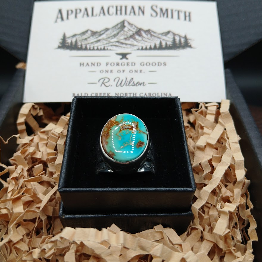 Turquoise ring in a black box with 'Appalachian Smith' branding in the background.