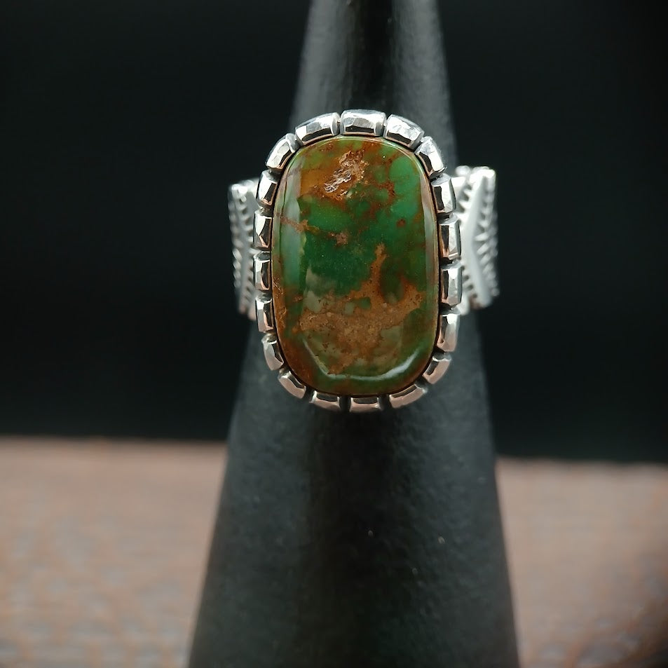 The Camelot — stone face-on, Sabbath Day Wood prop, forest green Nevada turquoise, dark background