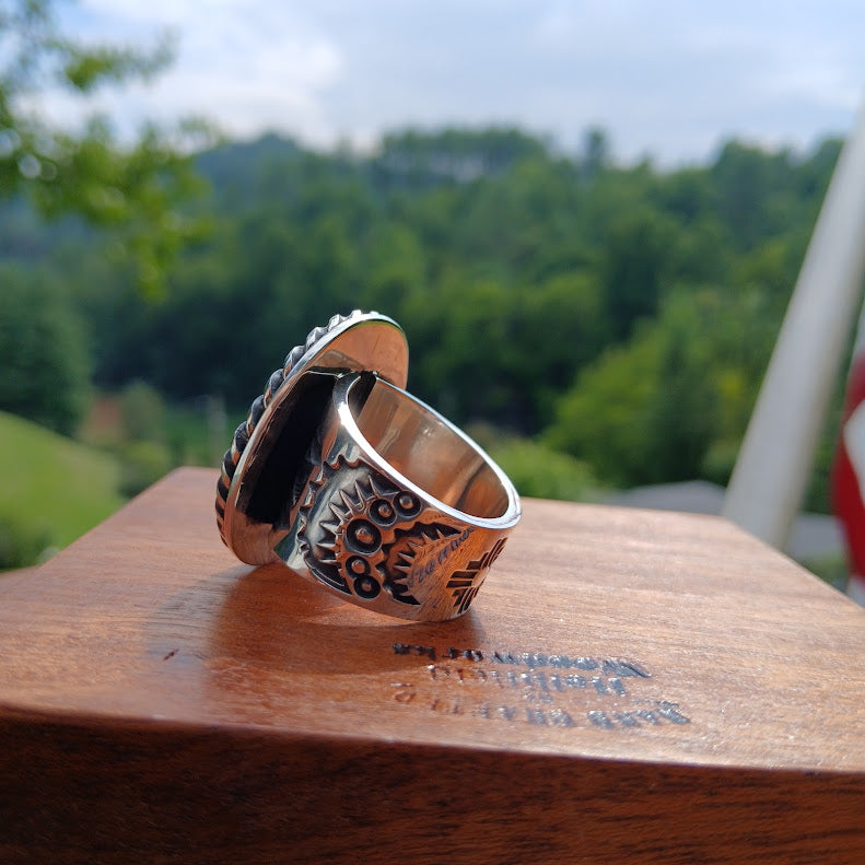 Royston ribbon turquoise ring — side profile showing tapered band width, black cone