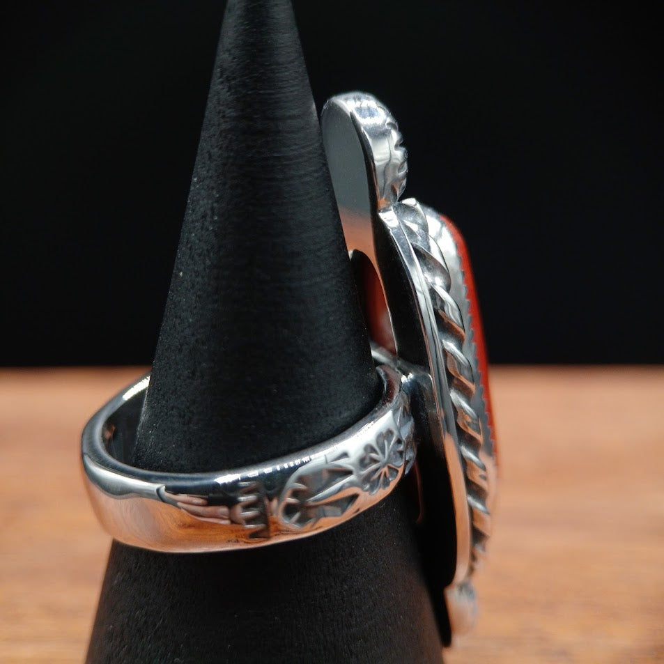 The Cardinal — face-on hero, black cone, Mediterranean red coral + sunburst conchos + rope bezel