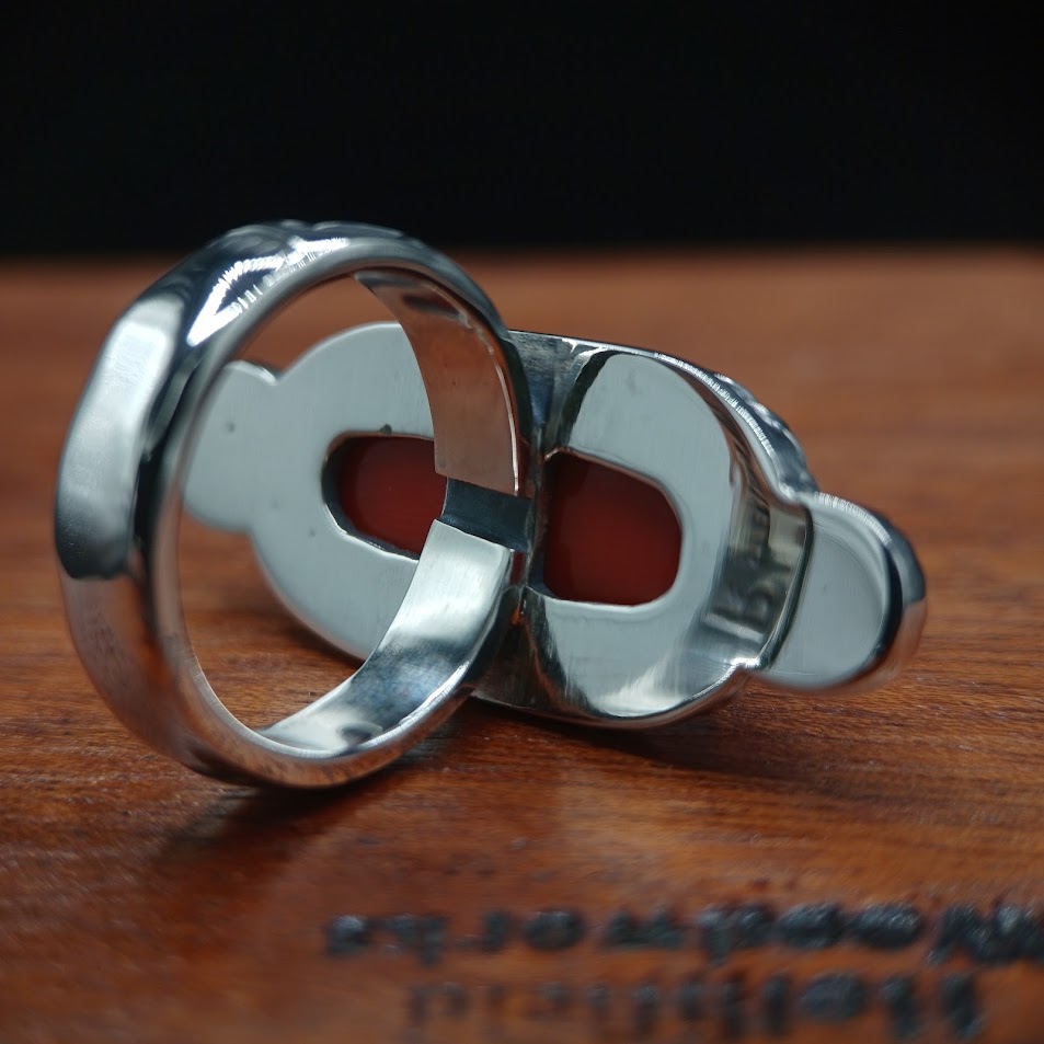 The Cardinal — back interior, coral visible through open-back setting