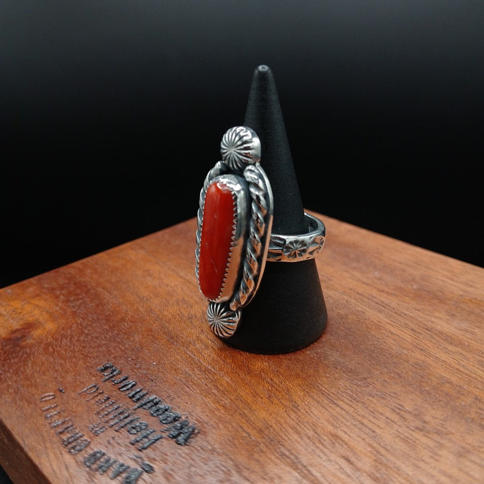 The Cardinal — stamp band detail, black cone, floral and leaf motifs