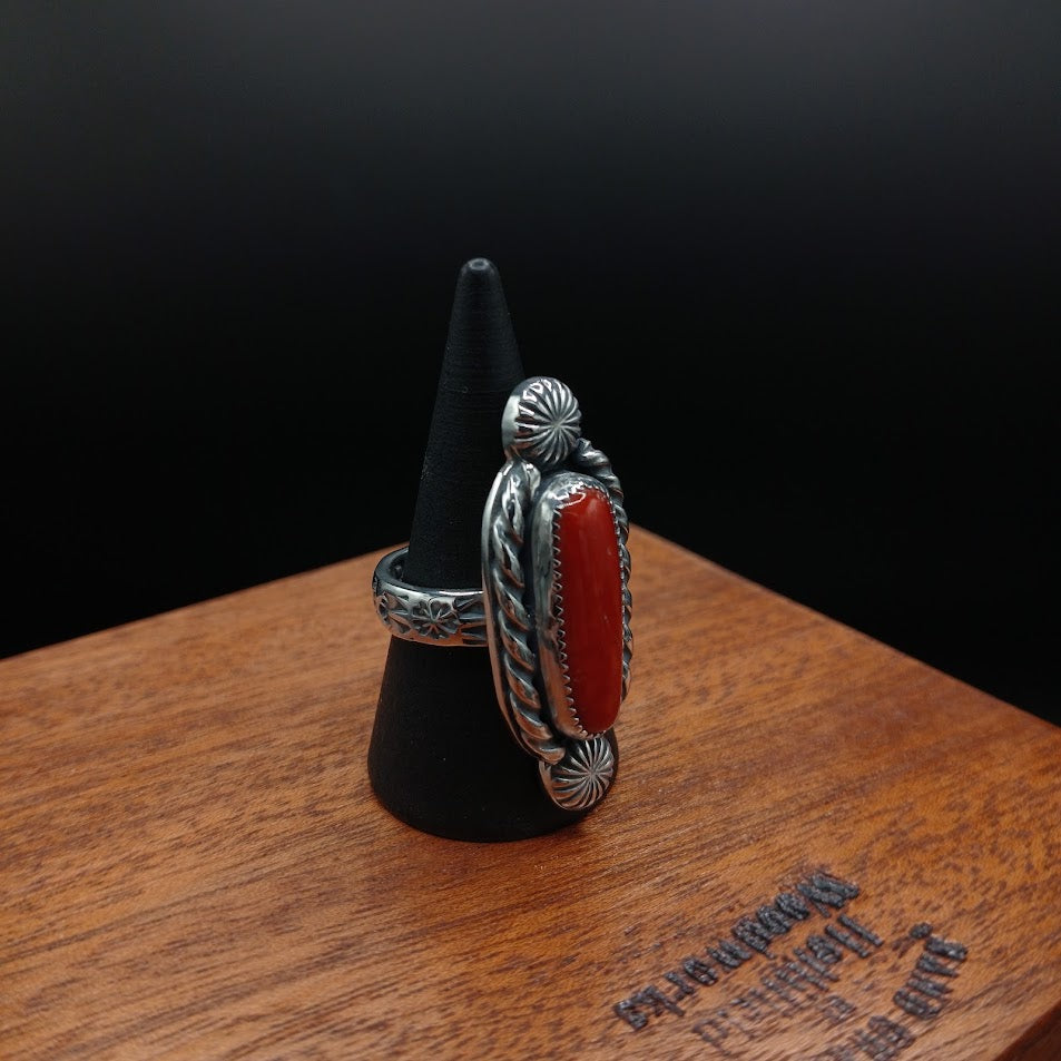 The Cardinal — left profile, black cone, rope bezel side + floral stamp band